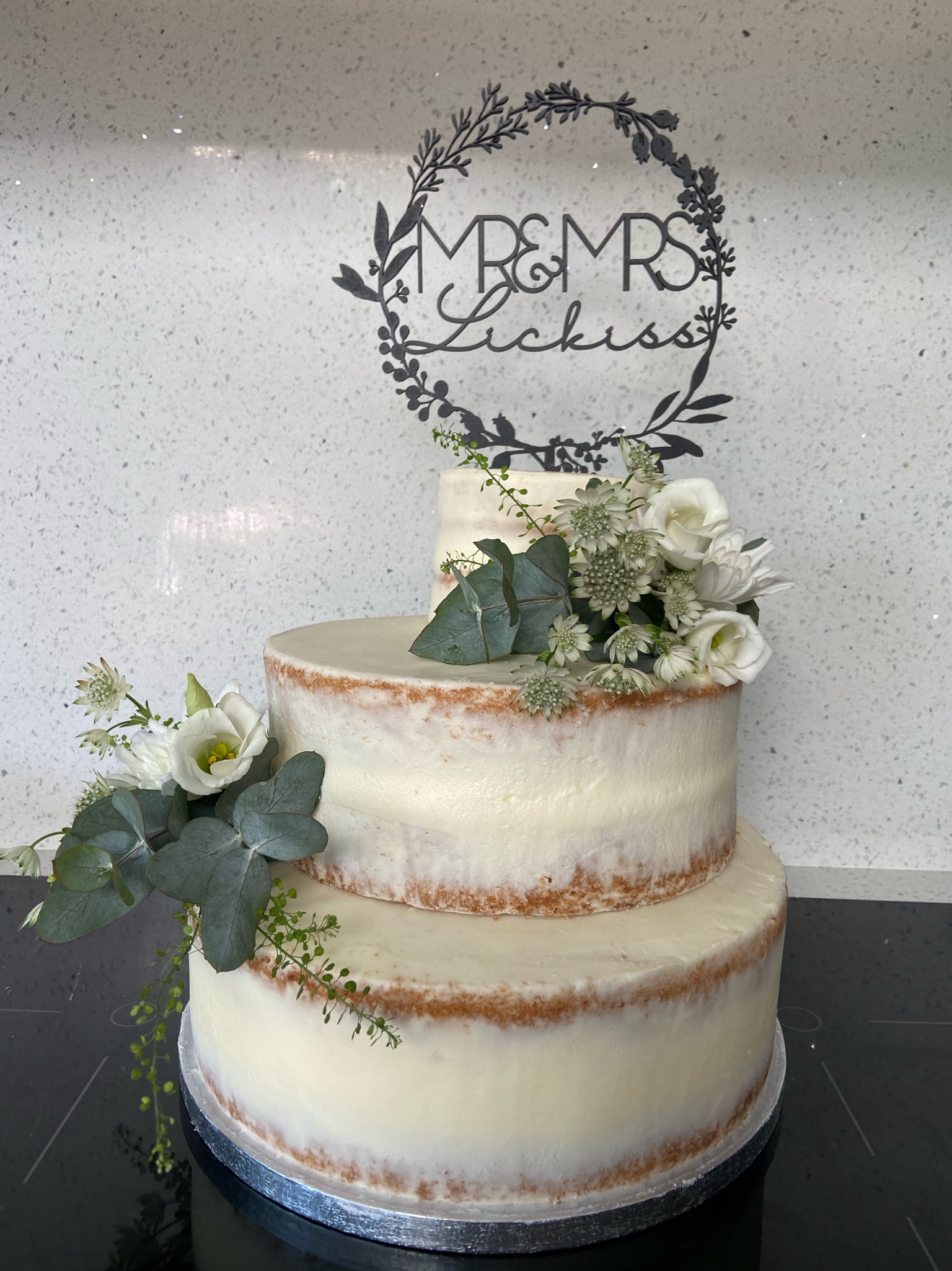 A Mr & Mrs wedding cake made by Yummy Treats